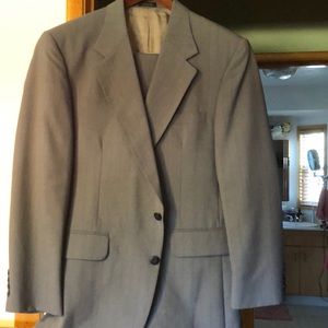 Gray striped suit. Preferred Stock brand.